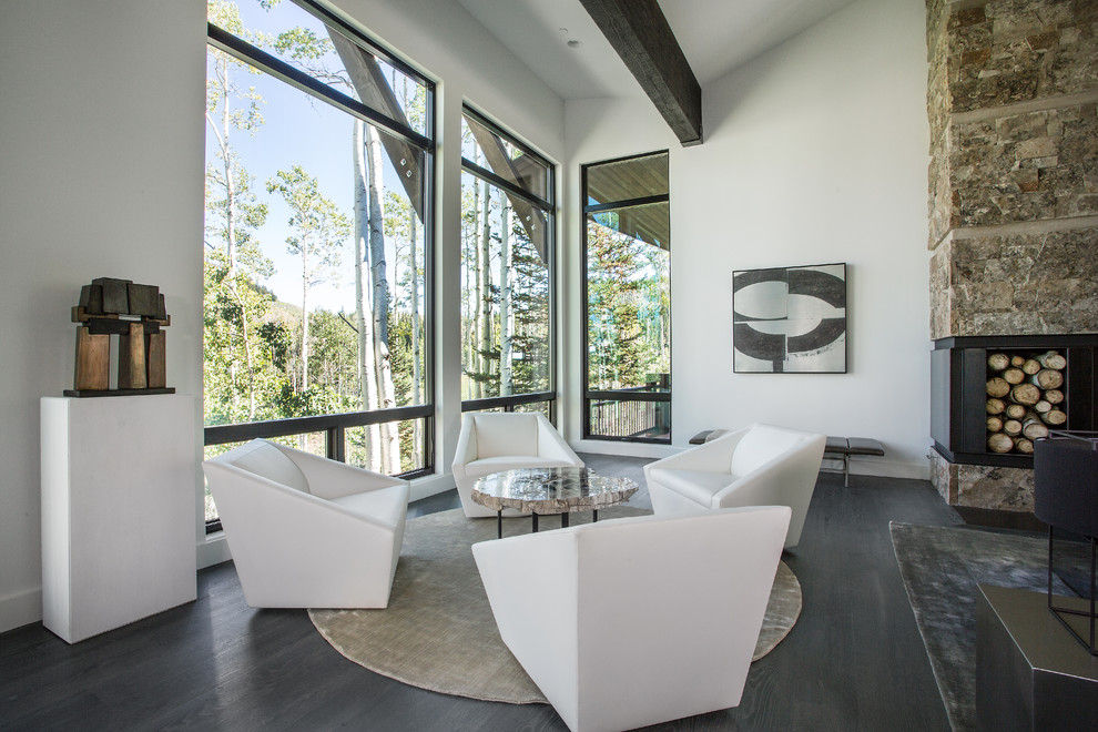 Contemporary open concept living room in Salt Lake City with white walls and dark hardwood floors.