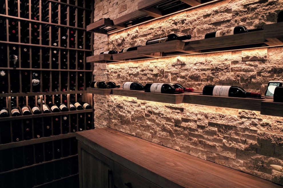Mid-sized transitional wine cellar in Los Angeles.