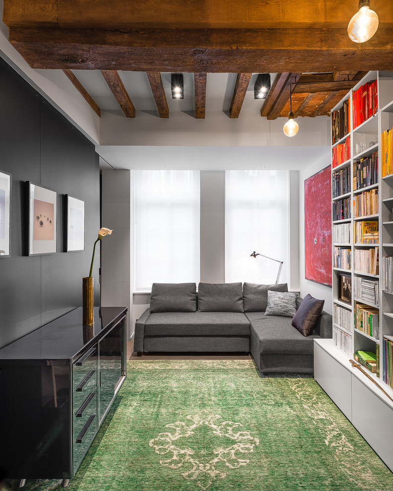 Photo of an industrial open concept family room in Lille.