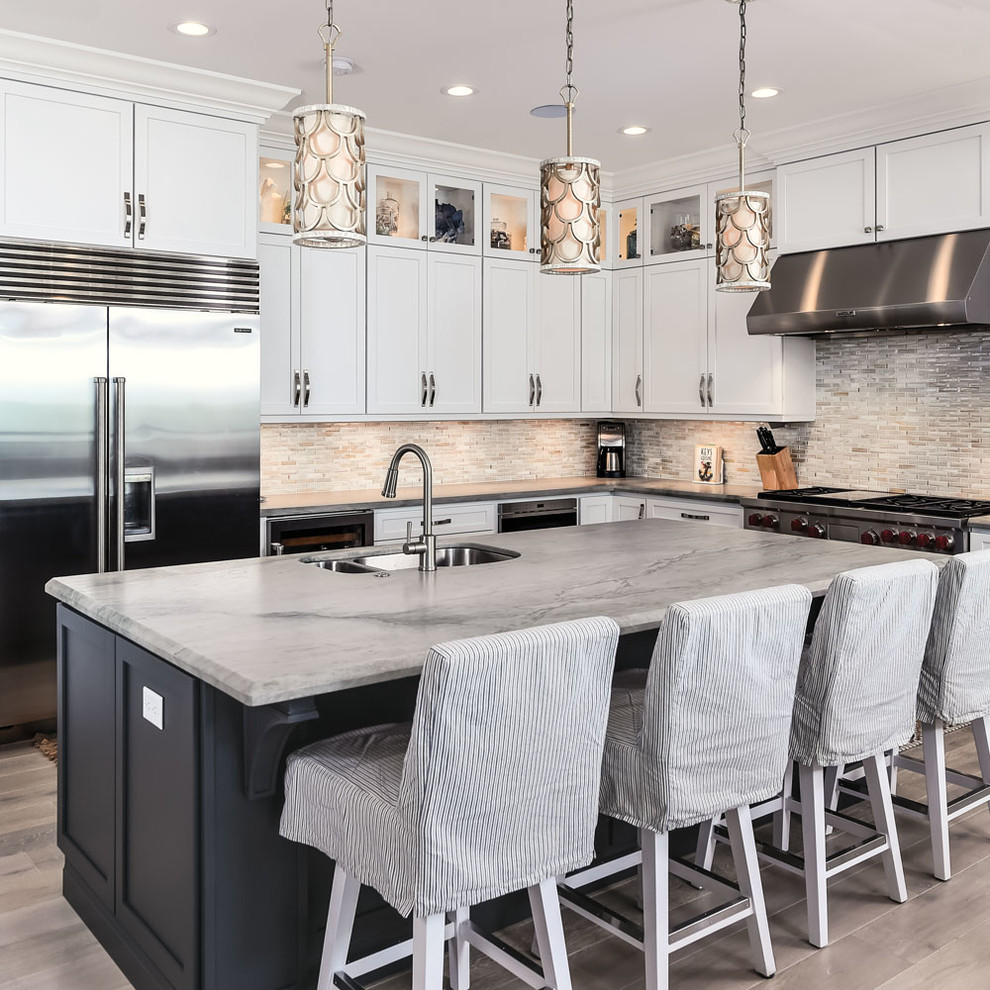 Design ideas for a large transitional u-shaped kitchen in Other with an undermount sink, white cabinets, grey splashback, stainless steel appliances, with island, beige floor and shaker cabinets.