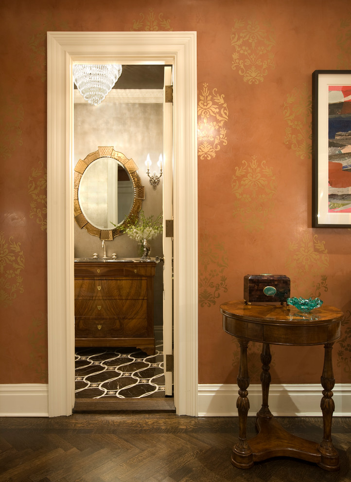 Traditional powder room in New York with flat-panel cabinets and medium wood cabinets.