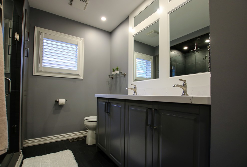 Small transitional bathroom in Toronto with shaker cabinets, grey cabinets, an open shower, grey walls, porcelain floors, a drop-in sink, engineered quartz benchtops, black floor and a hinged shower door.