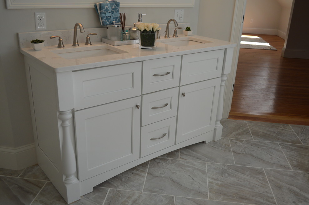 Example of a mid-sized transitional master beige tile and cement tile bathroom design in Boston with raised-panel cabinets, dark wood cabinets, a hot tub, an undermount sink, quartz countertops and beige countertops