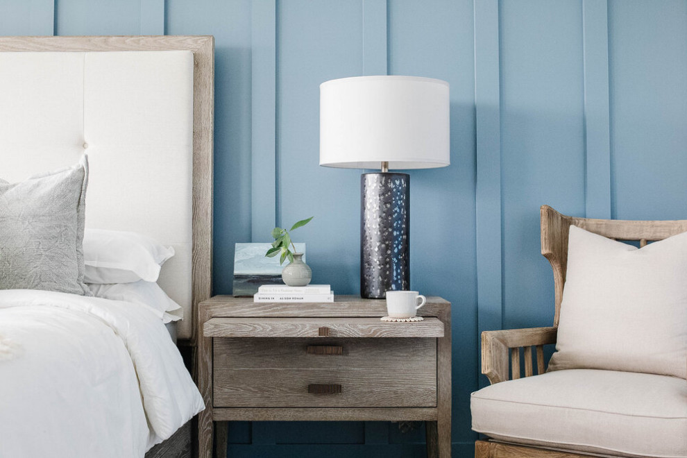 Bedroom - large coastal master wainscoting bedroom idea in Other with blue walls