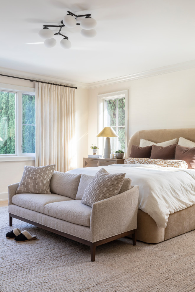 Example of a transitional bedroom design in Orange County