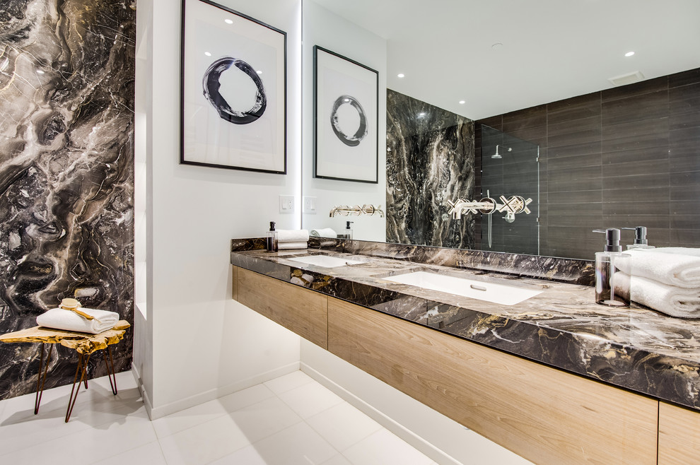 Inspiration for a contemporary master bathroom in Los Angeles with flat-panel cabinets, light wood cabinets, multi-coloured tile, stone slab, white walls, an undermount sink, white floor and multi-coloured benchtops.
