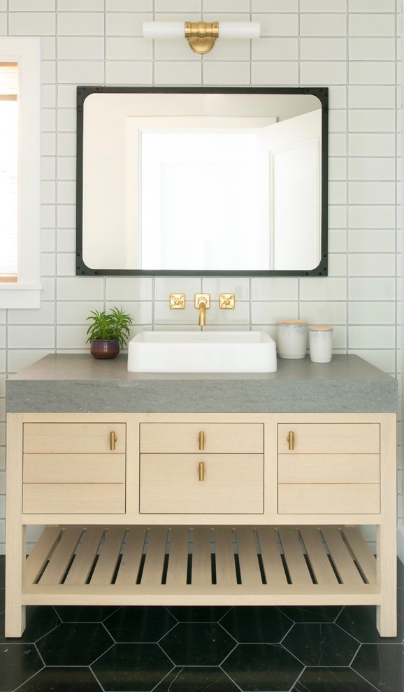 Inspiration for a beach style bathroom in Los Angeles with light wood cabinets, a shower/bathtub combo, white tile, subway tile, white walls, a vessel sink, black floor, grey benchtops and flat-panel cabinets.
