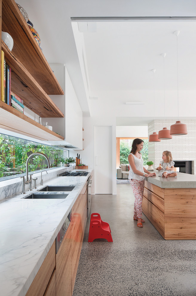 This is an example of a large contemporary kitchen in Sydney.