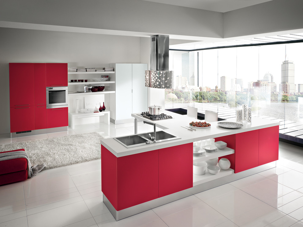 Inspiration for a mid-sized modern galley eat-in kitchen in San Diego with a double-bowl sink, flat-panel cabinets, red cabinets, solid surface benchtops, grey splashback, cement tile splashback, stainless steel appliances, ceramic floors and a peninsula.