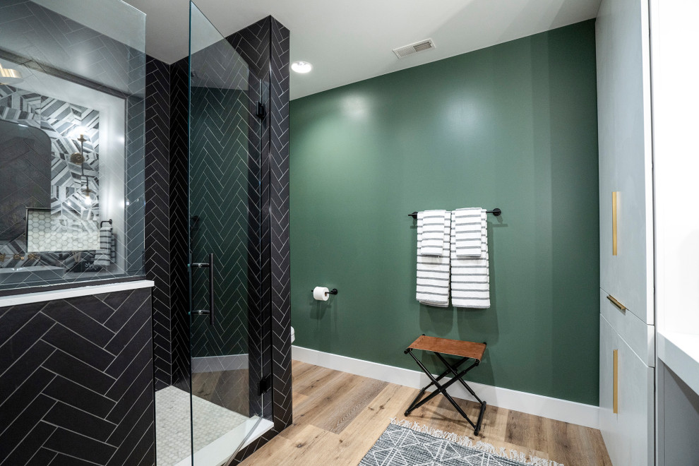 Inspiration for a mid-sized modern 3/4 bathroom in Other with flat-panel cabinets, white cabinets, an alcove shower, vinyl floors, marble benchtops, a hinged shower door, white benchtops, a single vanity, a built-in vanity and green walls.