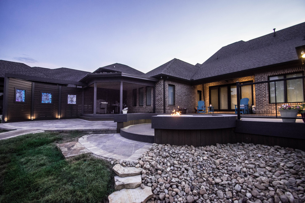 Large transitional backyard deck photo with a fire pit and no cover