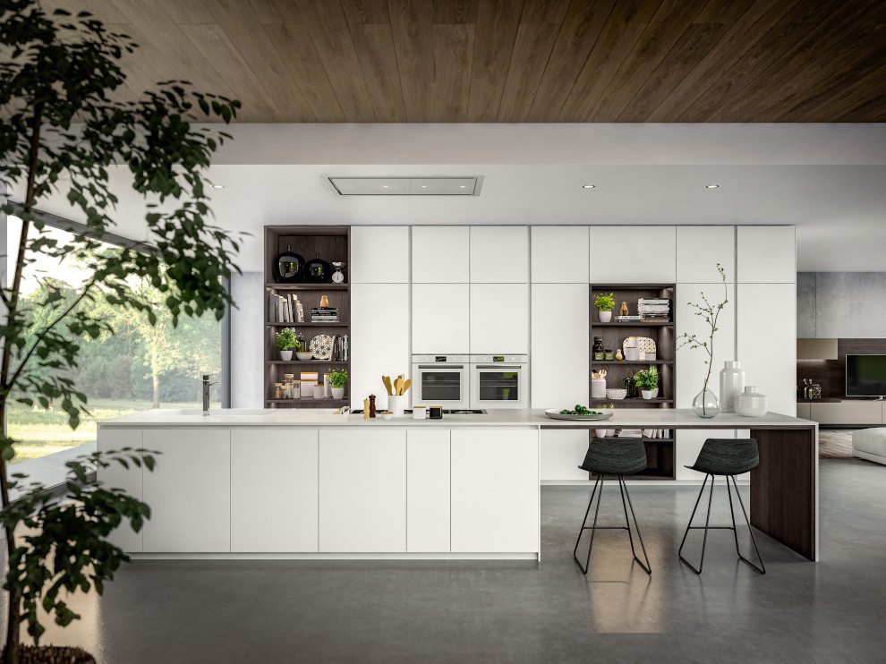 Foto di una cucina minimalista di medie dimensioni con lavello integrato, ante lisce, elettrodomestici bianchi e top bianco