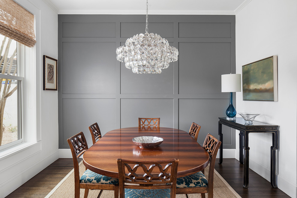 Large transitional dark wood floor and brown floor enclosed dining room photo in Austin with gray walls