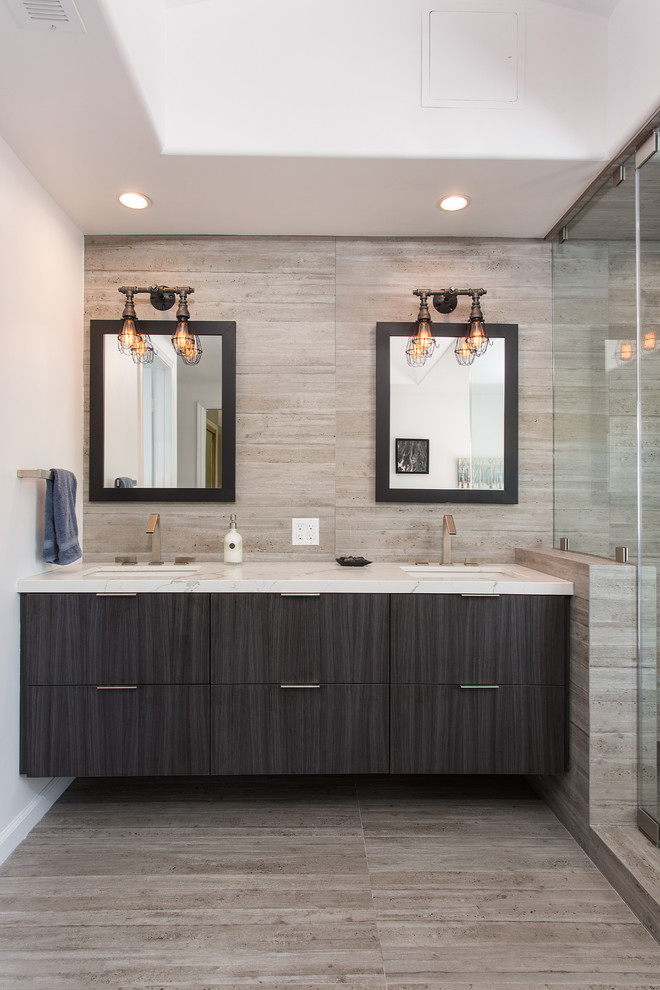 This is an example of a large scandinavian master bathroom in Los Angeles with raised-panel cabinets, dark wood cabinets, a corner tub, an alcove shower, brown tile, ceramic tile, white walls, light hardwood floors, an undermount sink, quartzite benchtops, brown floor, a hinged shower door and white benchtops.