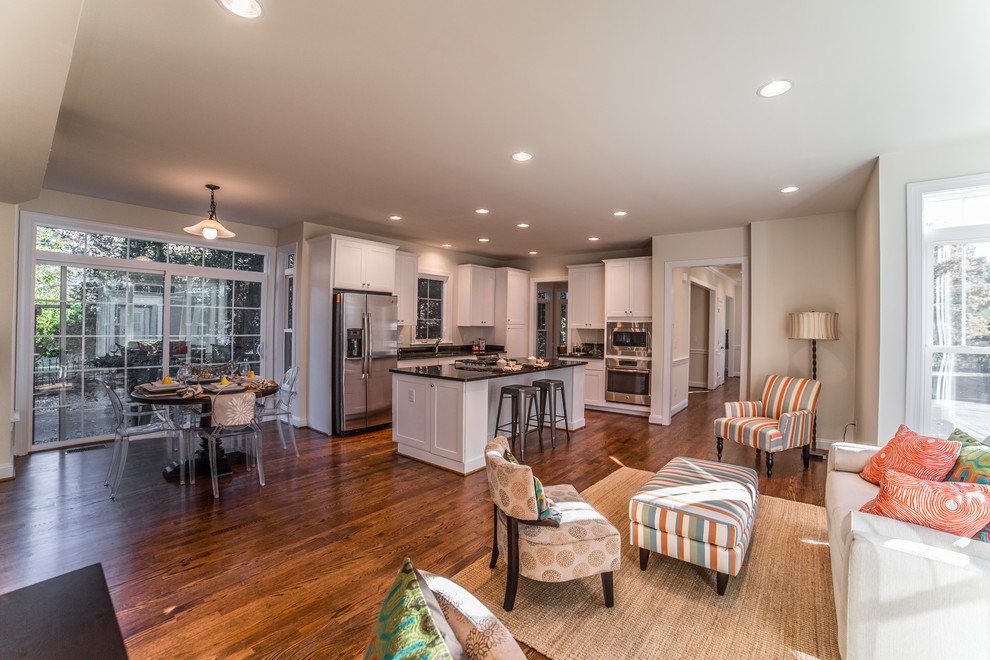 Inspiration for a mid-sized transitional dark wood floor open concept kitchen remodel in DC Metro with an undermount sink, recessed-panel cabinets, white cabinets, granite countertops, stainless steel appliances and an island