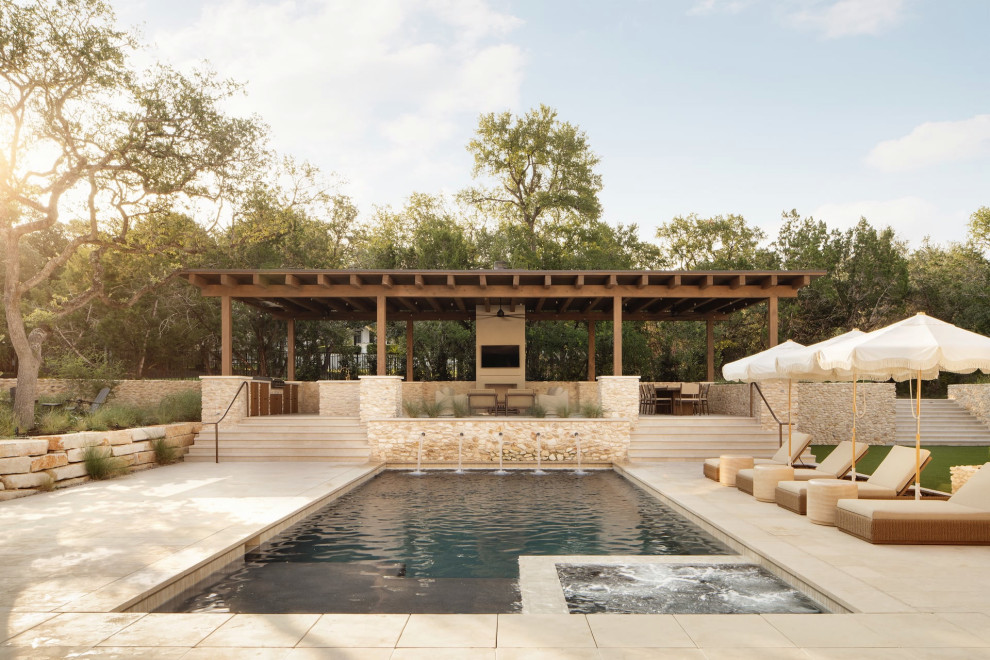 Example of a transitional rectangular pool fountain design in Austin