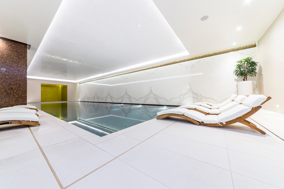Mid-sized contemporary indoor lap pool in London.