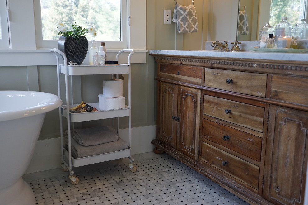 Inspiration for a mid-sized country master bathroom in San Francisco with raised-panel cabinets, medium wood cabinets, marble benchtops, a freestanding tub, a corner shower, white tile, stone tile, beige walls and porcelain floors.