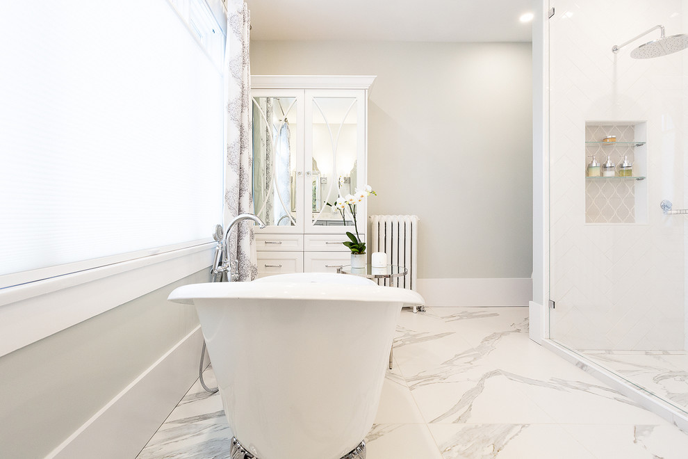 Design ideas for a mid-sized modern master bathroom in Other with shaker cabinets, white cabinets, a freestanding tub, an alcove shower, a one-piece toilet, white tile, subway tile, grey walls, an undermount sink, white floor, a hinged shower door and white benchtops.
