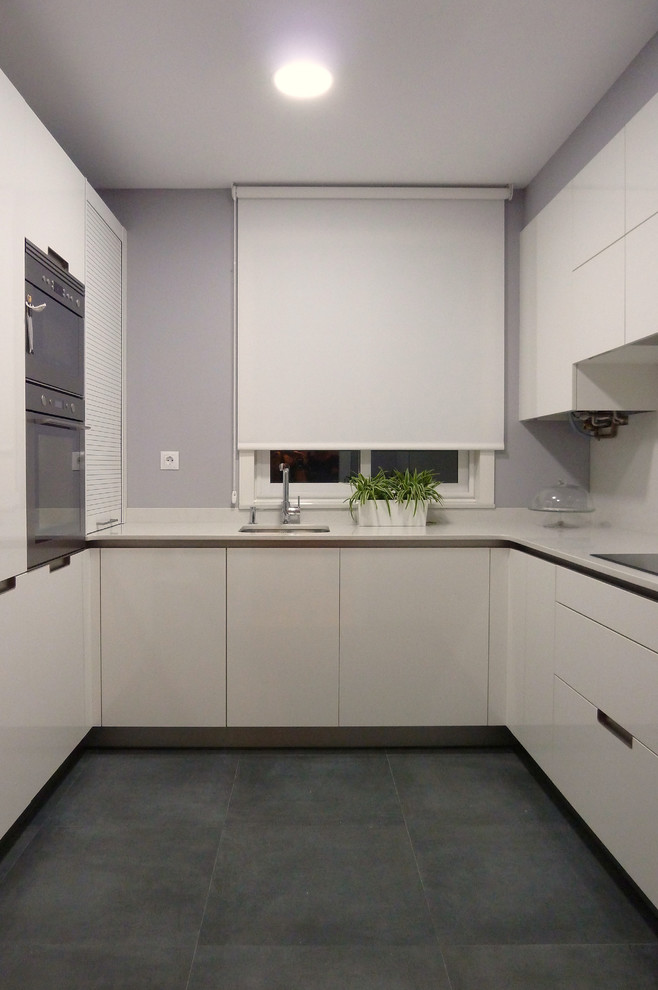 Design ideas for a small scandinavian l-shaped separate kitchen in Other with a single-bowl sink, flat-panel cabinets, white cabinets, white splashback, stainless steel appliances, ceramic floors and no island.