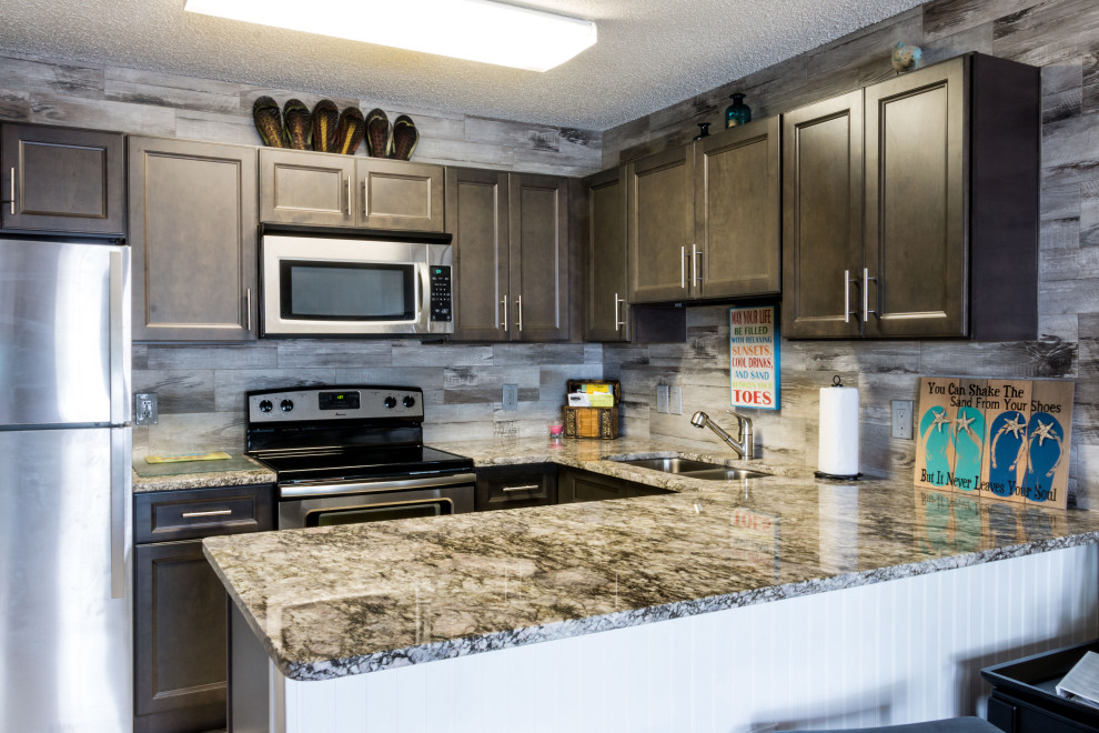 Small mountain style u-shaped cement tile floor and beige floor eat-in kitchen photo with an undermount sink, flat-panel cabinets, medium tone wood cabinets, granite countertops, gray backsplash, ceramic backsplash, stainless steel appliances, a peninsula and gray countertops