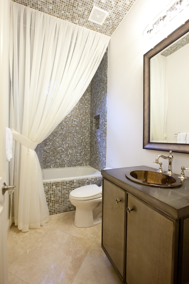 This is an example of a mid-sized traditional 3/4 bathroom in Miami with mosaic tile, flat-panel cabinets, brown cabinets, an alcove tub, a shower/bathtub combo, multi-coloured tile, white walls, travertine floors, a drop-in sink, concrete benchtops, beige floor and a shower curtain.