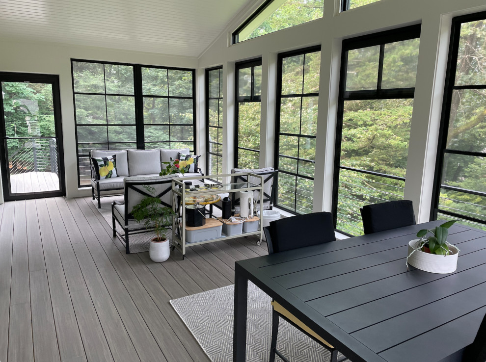 Large screened-in verandah in New York with cable railing.
