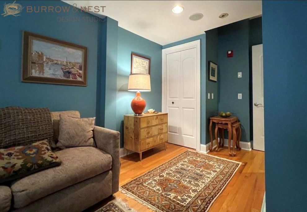 Example of a family room design in Providence with blue walls