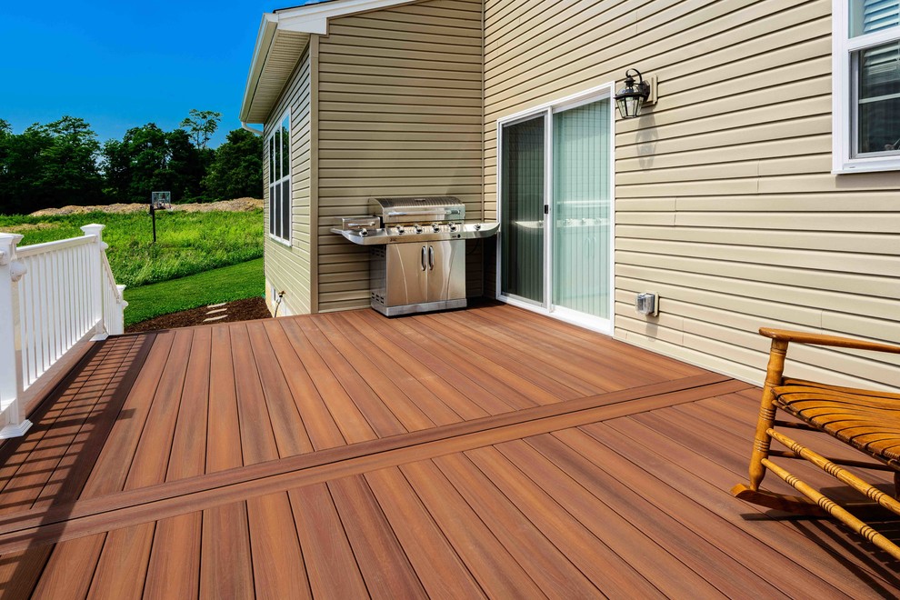 Deck - mid-sized transitional backyard deck idea with no cover