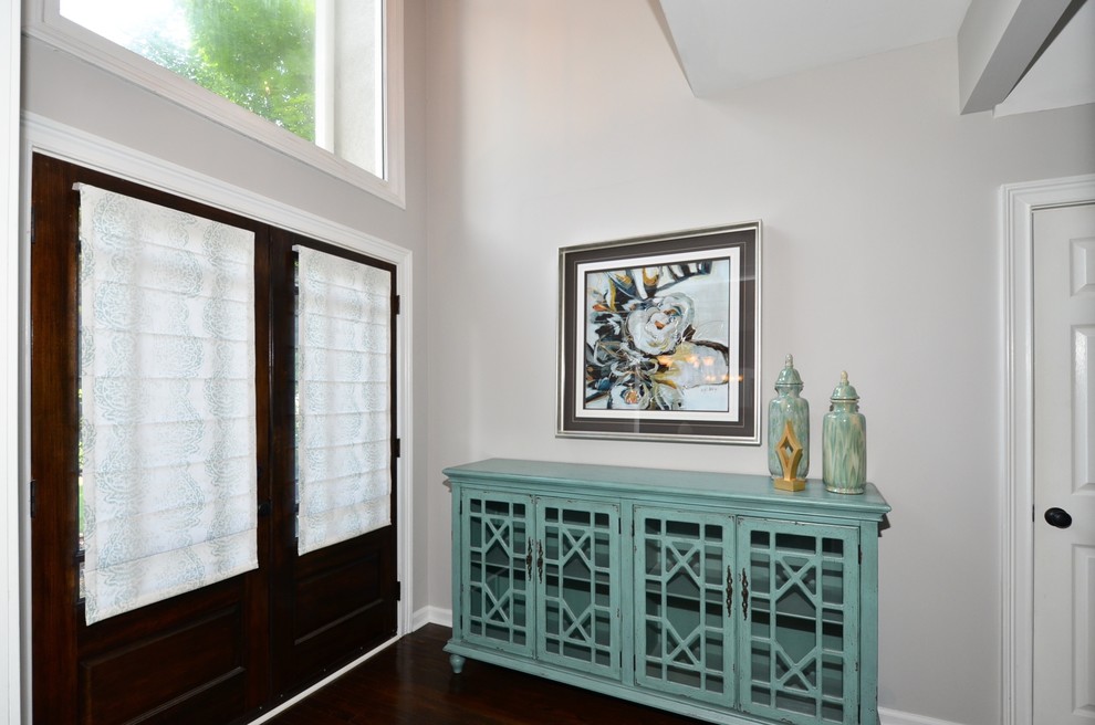 Inspiration for a mid-sized transitional dark wood floor foyer remodel in Atlanta with gray walls and a dark wood front door