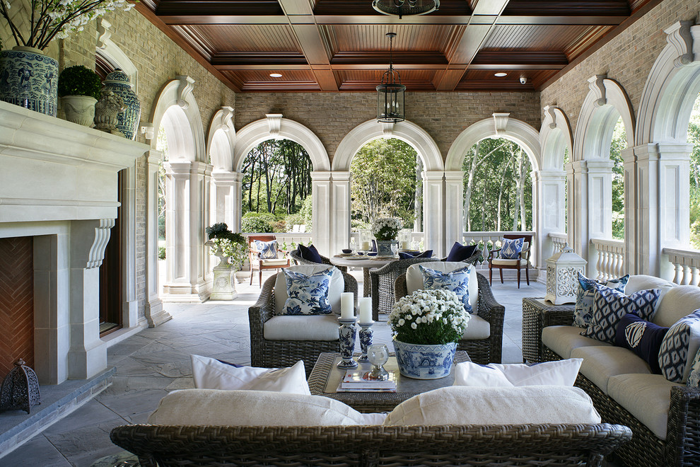 Inspiration for a traditional patio in New York with with fireplace.