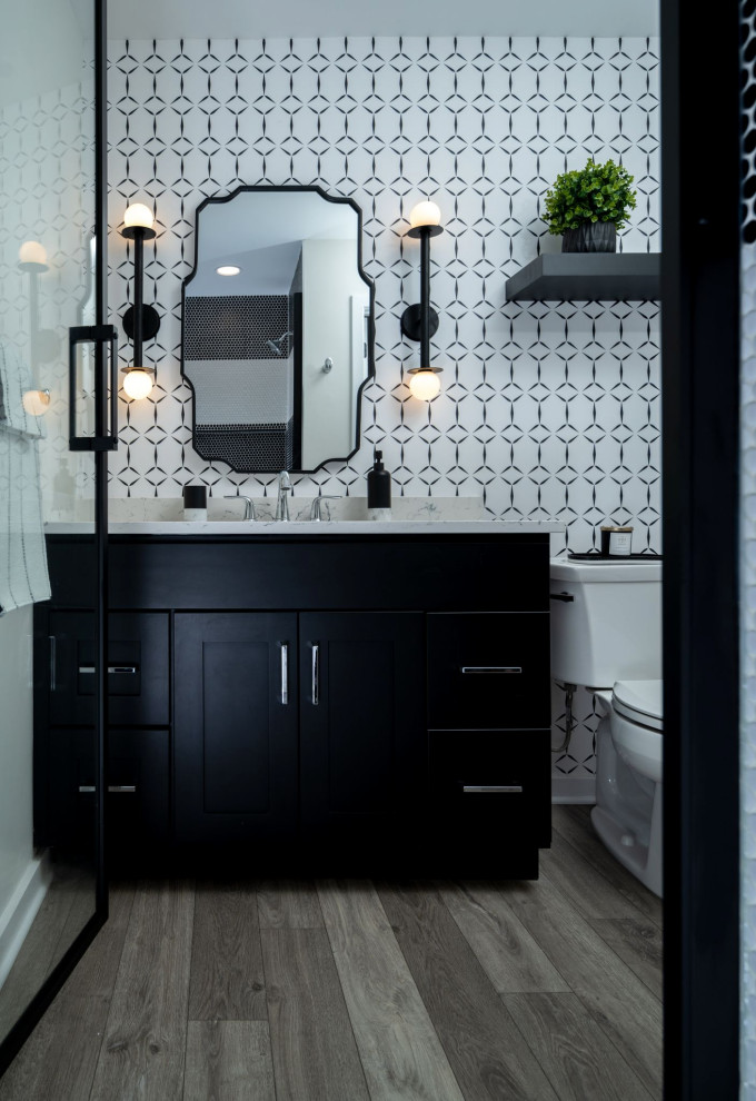 Inspiration for a medium sized modern cloakroom in Philadelphia with shaker cabinets, black cabinets, a two-piece toilet, black and white tiles, mosaic tiles, white walls, vinyl flooring, a submerged sink, engineered stone worktops, grey floors, turquoise worktops, a built in vanity unit and wallpapered walls.