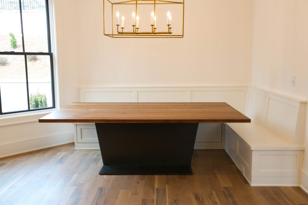 Large minimalist dining room photo in Atlanta with white walls