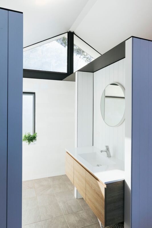 Design ideas for a small contemporary master wet room bathroom in Sydney with furniture-like cabinets, light wood cabinets, a wall-mount toilet, black and white tile, mosaic tile, white walls, ceramic floors, a wall-mount sink, grey floor and an open shower.