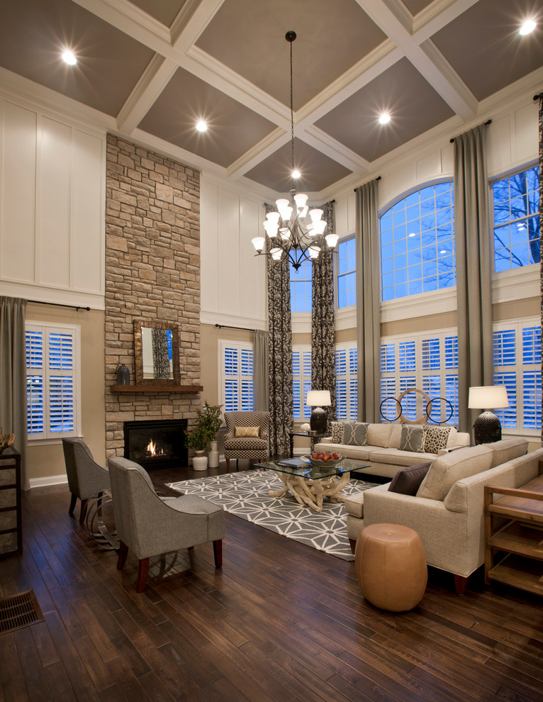 Traditional formal open concept living room in Boston with white walls, dark hardwood floors, a standard fireplace, a stone fireplace surround and coffered.