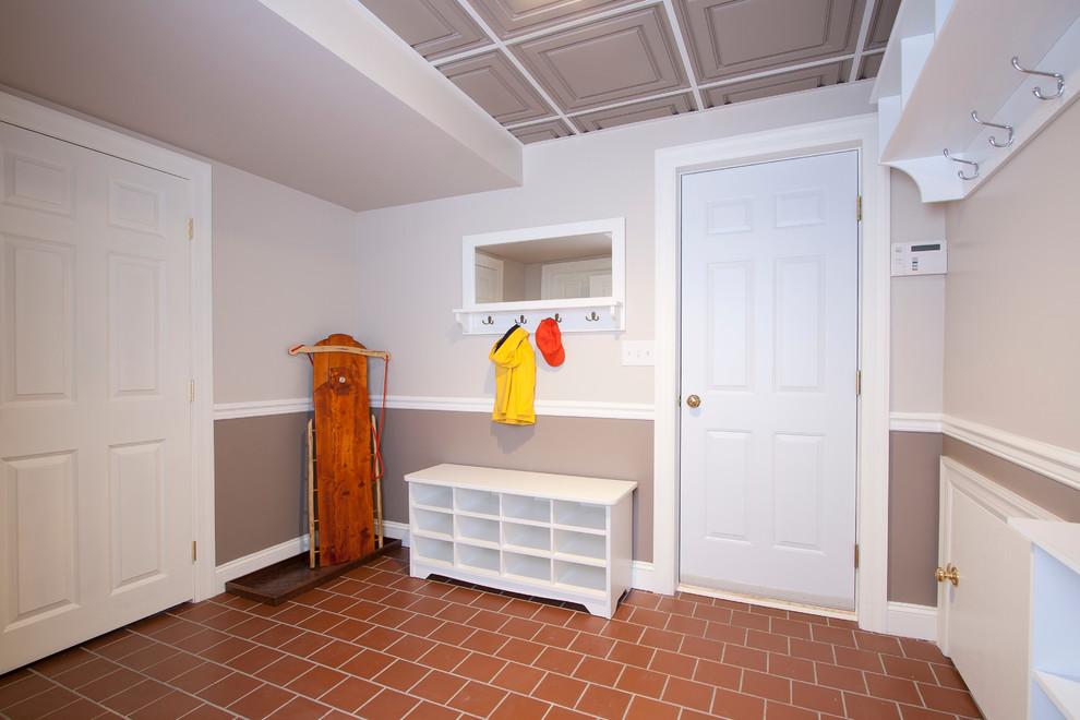 Inspiration for a mid-sized traditional mudroom in Newark with multi-coloured walls, ceramic floors, a single front door and a white front door.