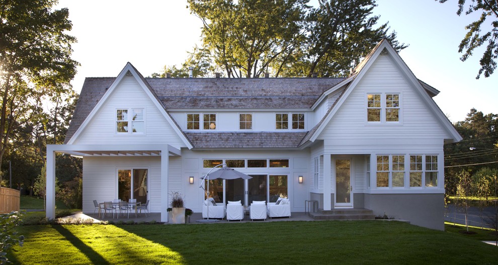 Inspiration for a traditional exterior in Minneapolis with wood siding and a gable roof.