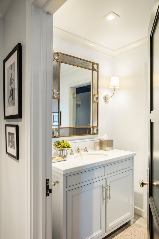 Design ideas for a transitional powder room in Los Angeles.