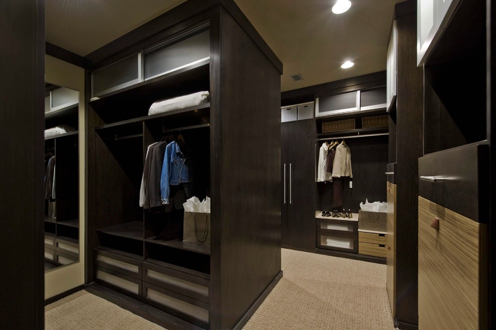 Inspiration for a modern storage and wardrobe in Denver with dark wood cabinets.
