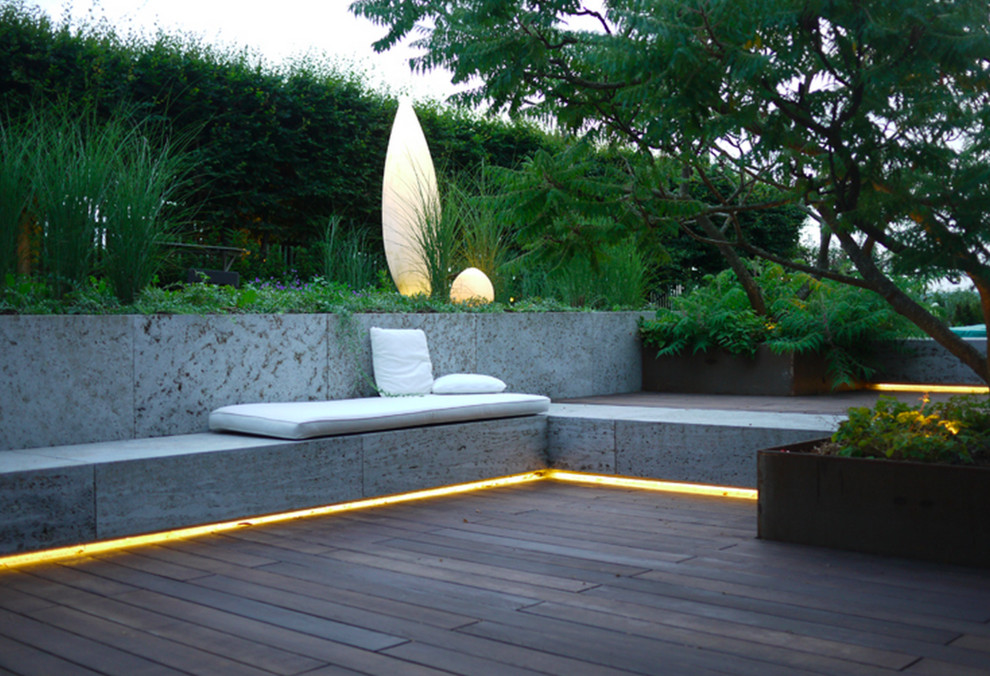 This is an example of a mid-sized contemporary deck in Munich with no cover.