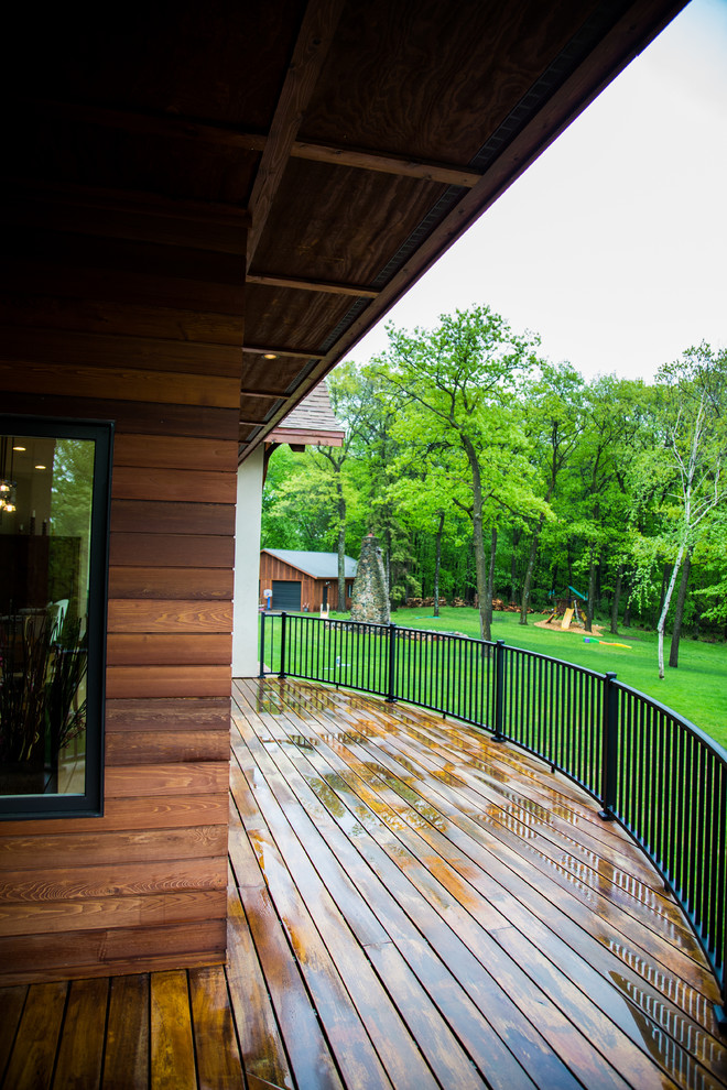 Transitional three-story mixed siding gable roof idea in Minneapolis with a shingle roof
