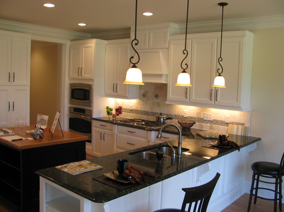 Example of a transitional kitchen design in Raleigh