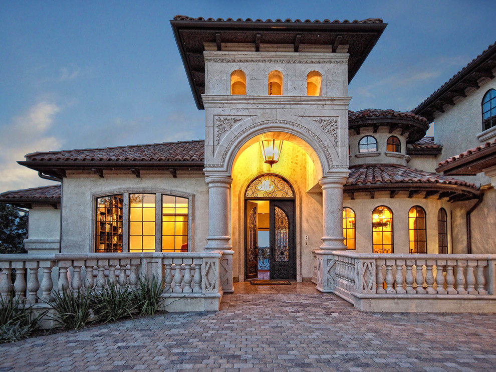 This is an example of a mediterranean two-storey exterior in Austin.