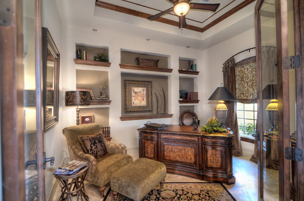 Photo of a large mediterranean study room in Houston with beige walls, porcelain floors and a freestanding desk.