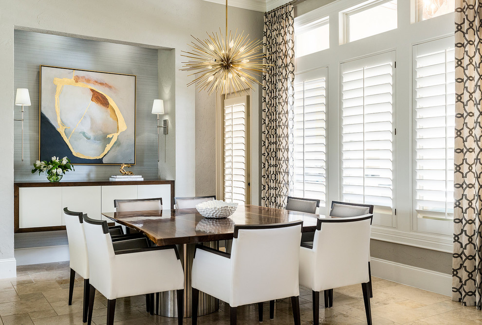Inspiration for a transitional separate dining room in Houston with grey walls and beige floor.