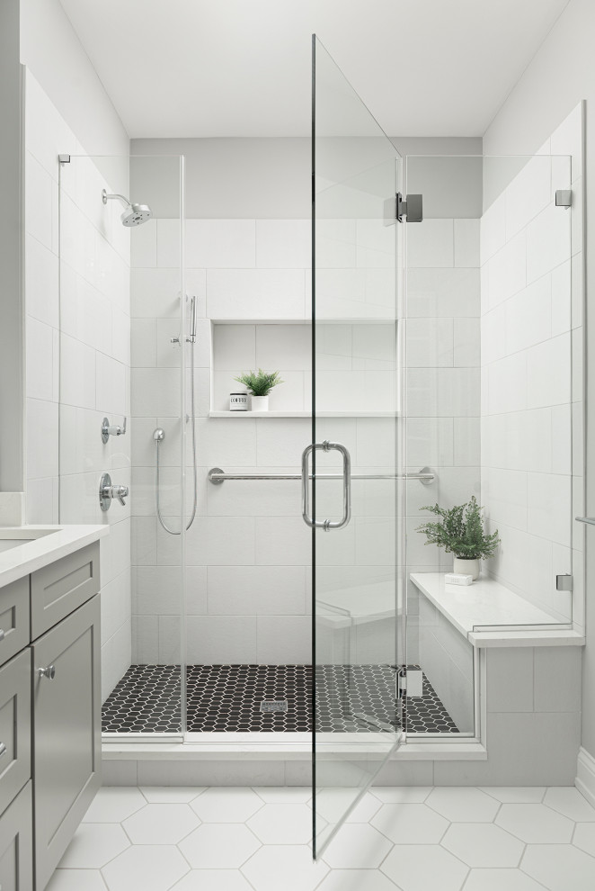Example of a mid-sized transitional master white tile and porcelain tile porcelain tile, white floor and double-sink alcove shower design in Chicago with shaker cabinets, gray cabinets, gray walls, an undermount sink, quartz countertops, a hinged shower door, white countertops, a niche and a floating vanity