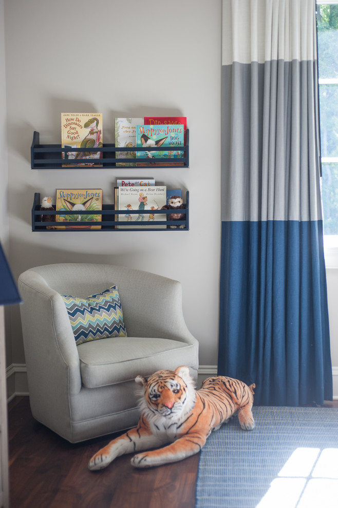 This is an example of a large transitional kids' bedroom for boys in Other.
