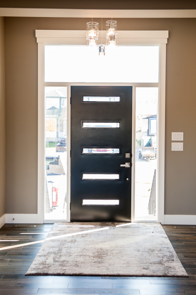 Example of a transitional home design design in Edmonton