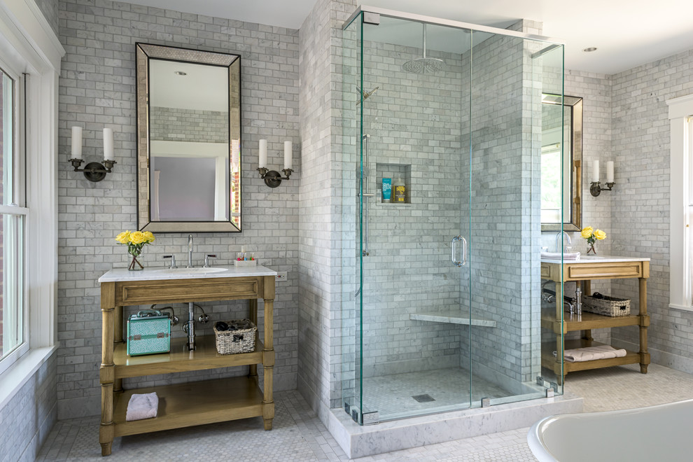 Mid-sized traditional master bathroom in Houston with a corner shower, white tile, gray tile, mosaic tile floors, light wood cabinets, a freestanding tub, stone tile, an undermount sink, quartzite benchtops, white floor and a hinged shower door.