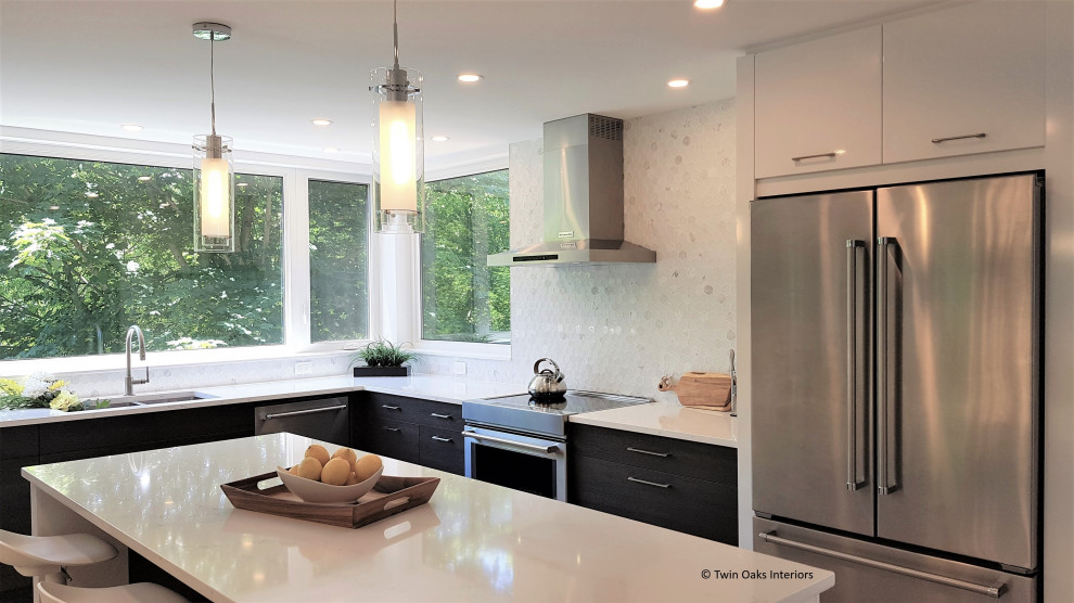 Photo of a mid-sized modern l-shaped eat-in kitchen in Toronto with an undermount sink, flat-panel cabinets, dark wood cabinets, quartz benchtops, white splashback, mosaic tile splashback, stainless steel appliances, ceramic floors, with island and white benchtop.